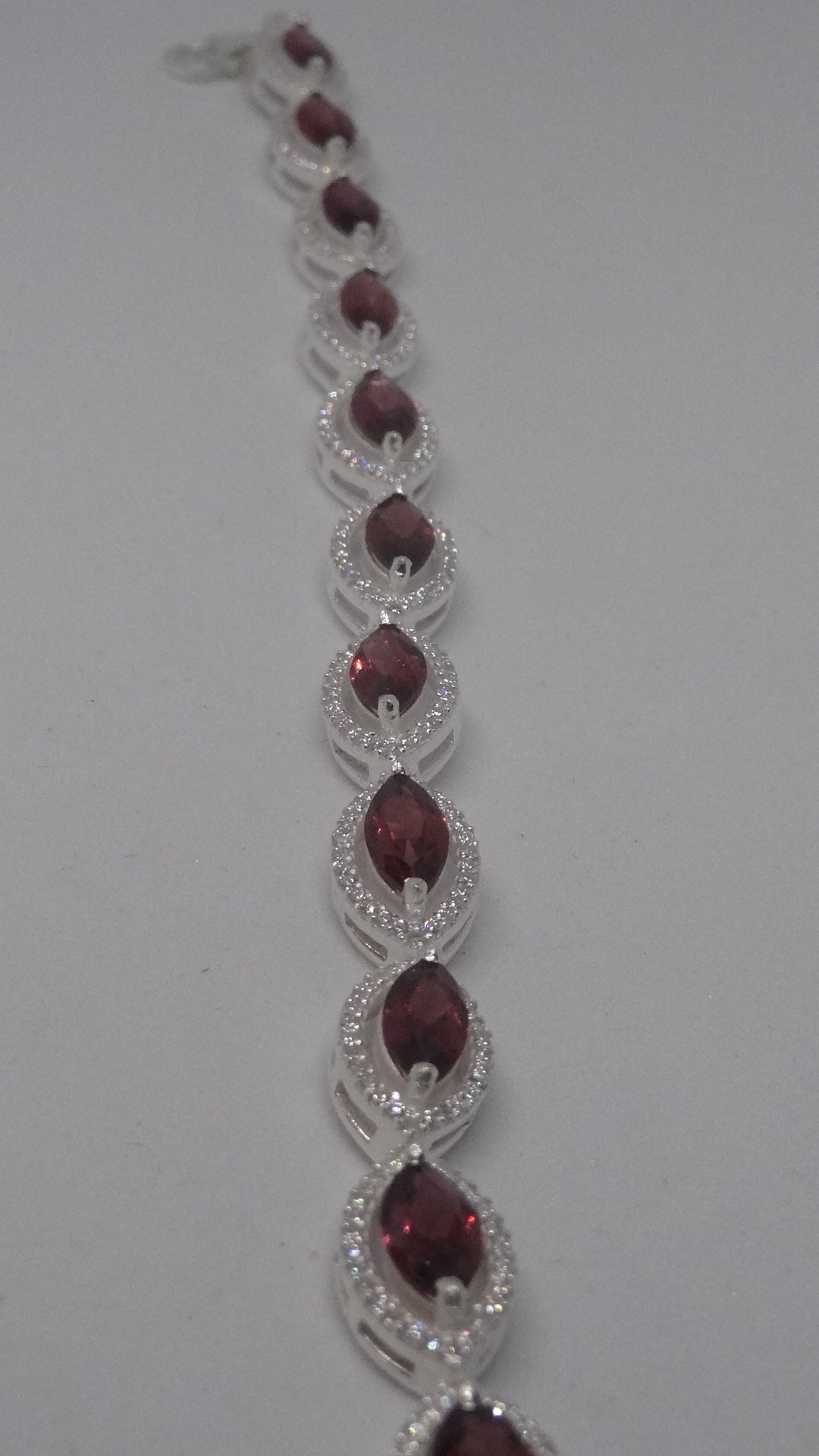92.5 Silver Bracelet With Marquise Shaped Garnet And American Diamonds