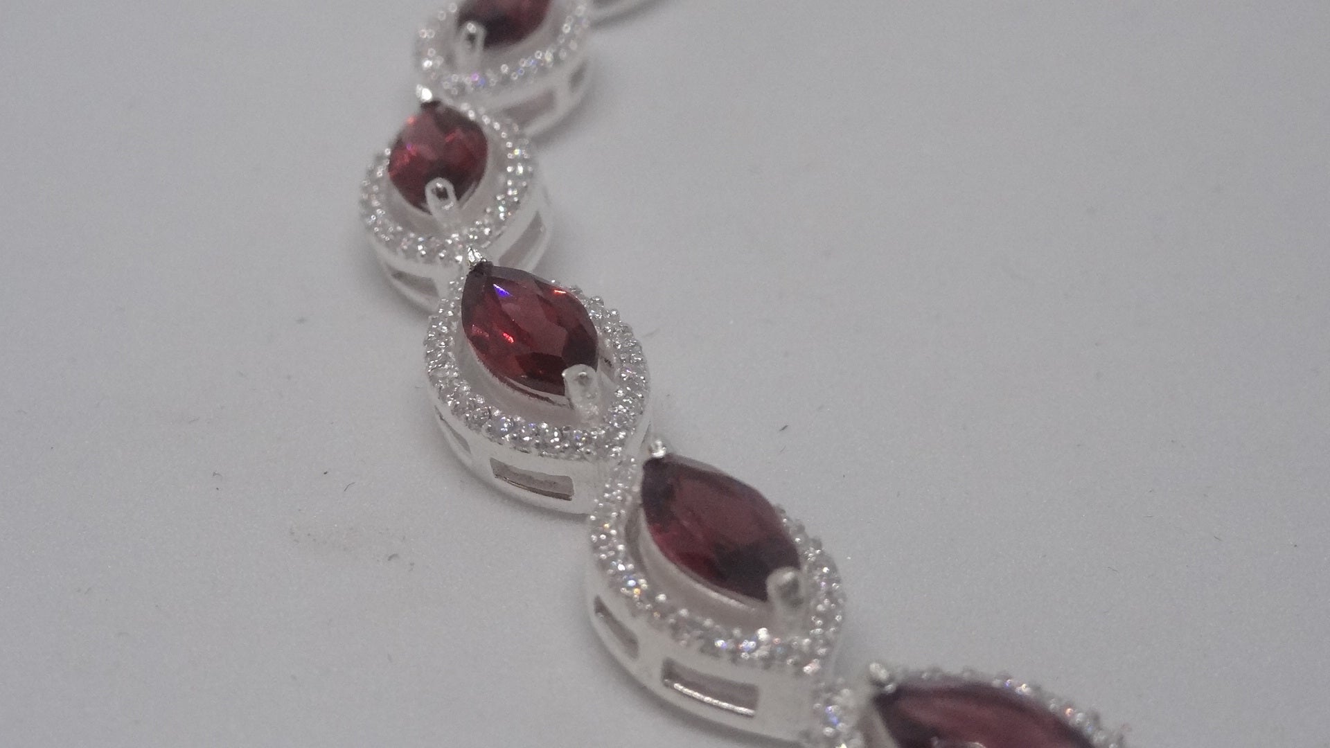 92.5 Silver Bracelet With Marquise Shaped Garnet And American Diamonds