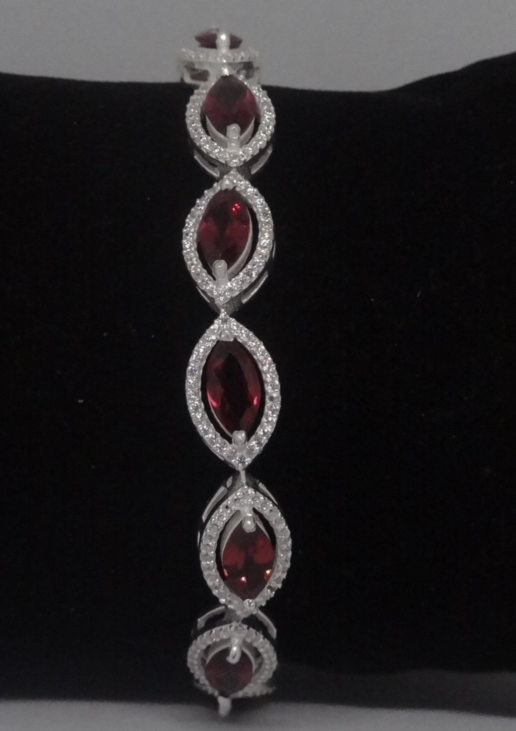 92.5 Silver Bracelet With Marquise Shaped Garnet And American Diamonds